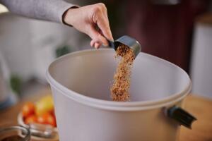 Sprinkle-bokashi-bran-on-the-bottom-of-Bokashi-Organko-Essential image-low-res